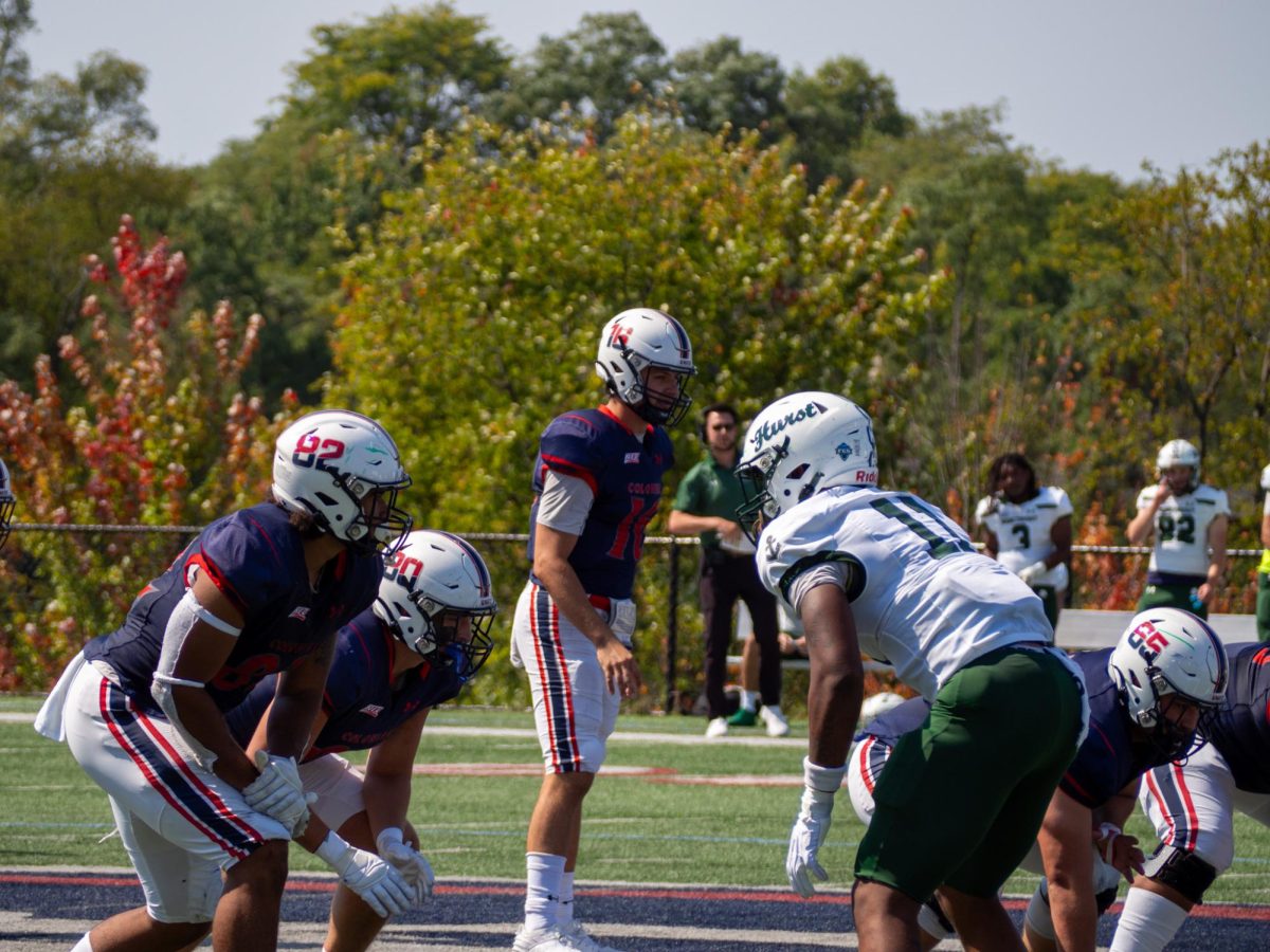 Anthony Chiccitt prepares to take a snap during his 5 TD performance against Mercyhurst.  Photo Credits: Malena Kaniuff