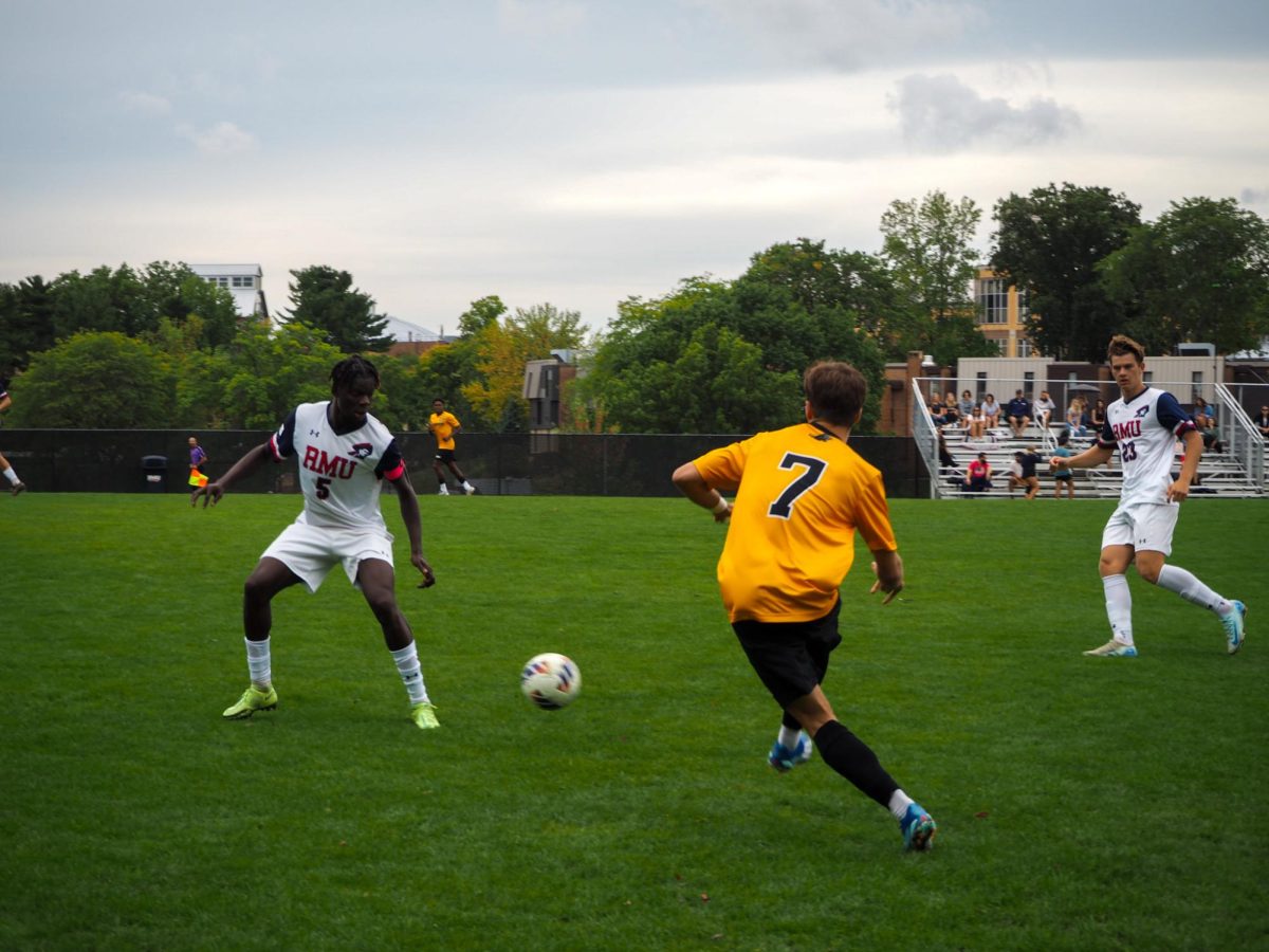 Colonial Captain William Dodzi Afawubo defends a Milwaukee pass during Saturday's matchup - Photo Credits: Malena Kaniuff